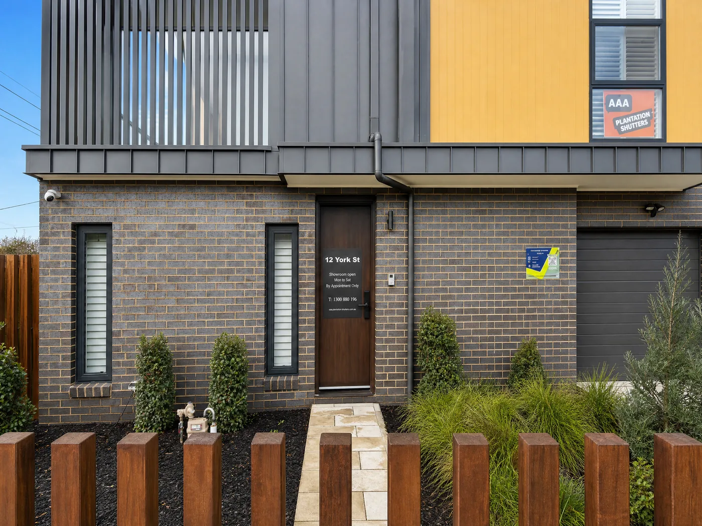 Plantation shutter showroom Melbourne — exterior front entrance with signage and display panels