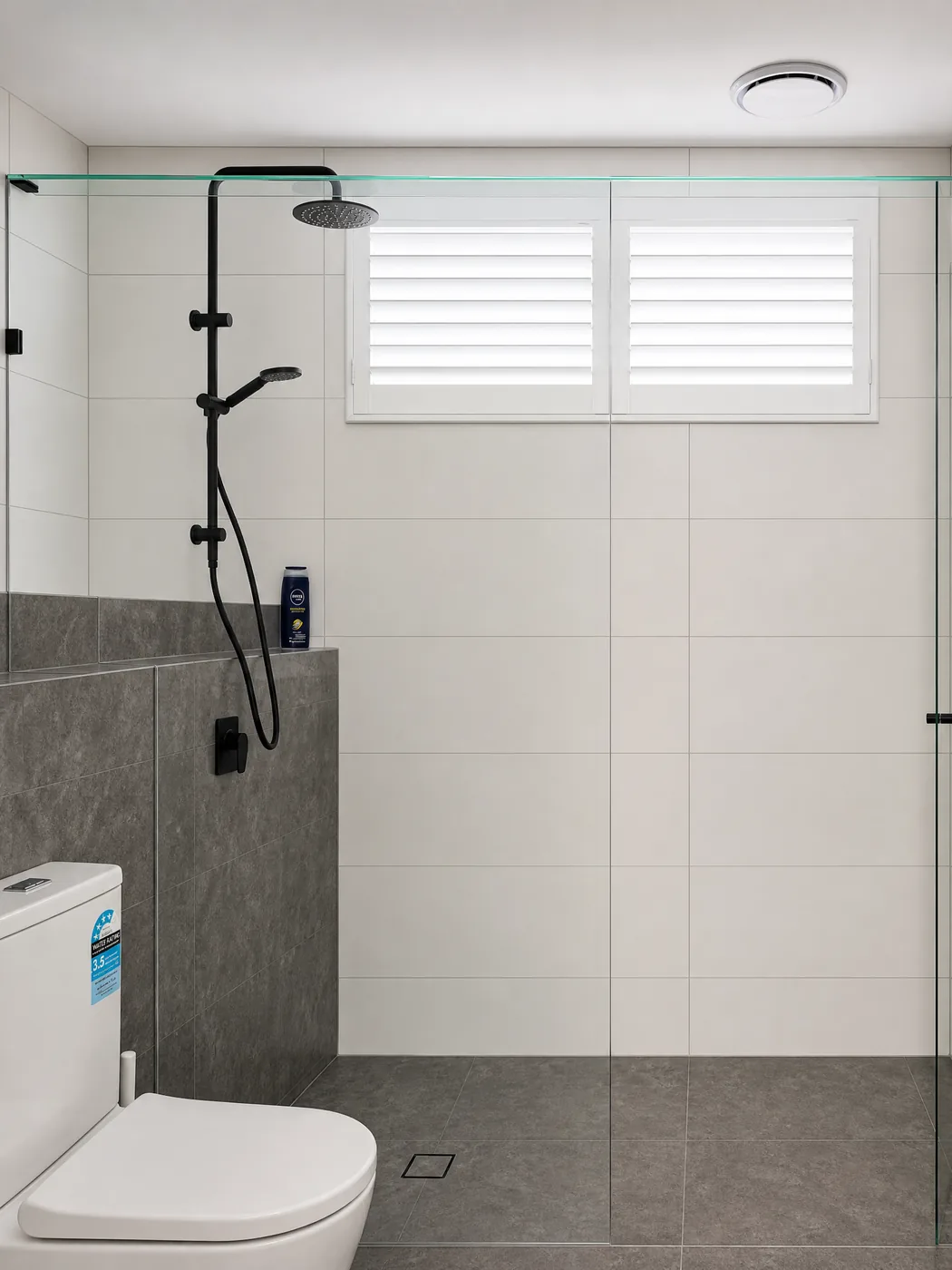 PVC shutters Melbourne bathroom — 63mm blade waterproof plantation shutters on display at showroom