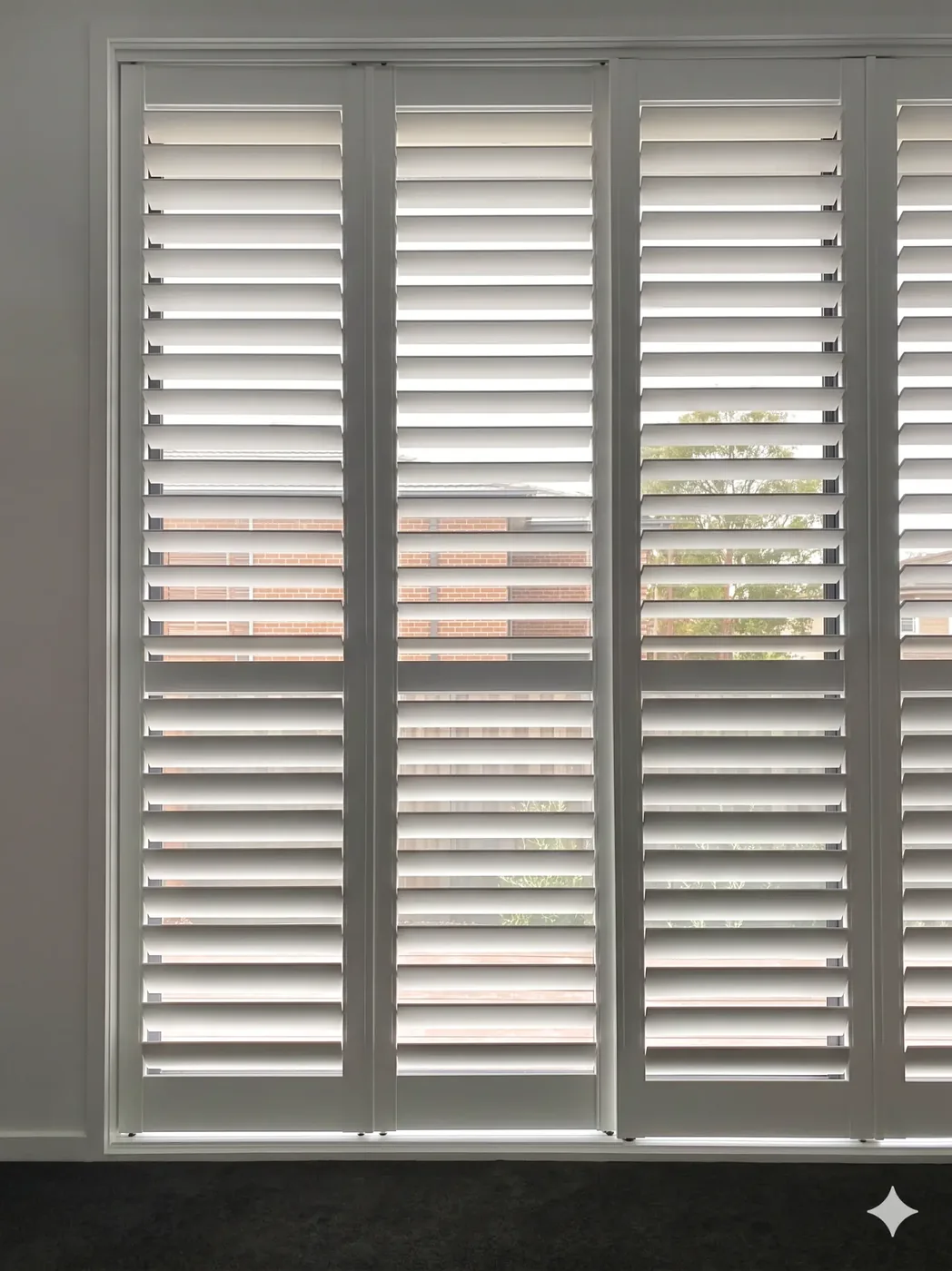 Sliding shutters Melbourne — close-up of sliding plantation shutter panel and track system