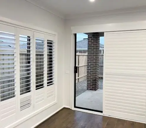 Sliding shutters fitted in a bedroom for light control