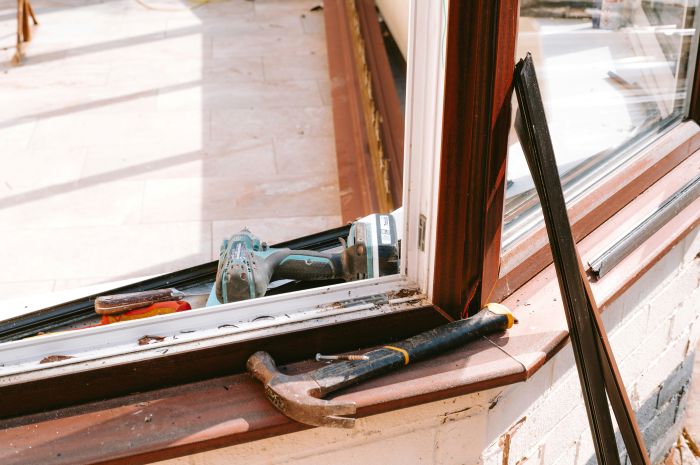 Window under repair before custom shutter installation