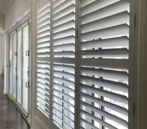 Hinged plantation shutters fitted to a Melbourne home window