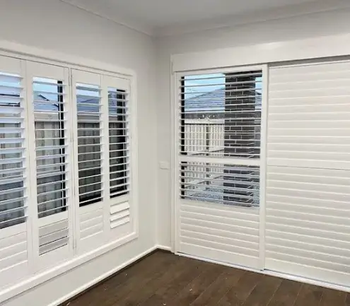 Sliding plantation shutters across a large Melbourne window