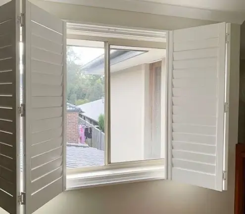 Timber hinged shutters showing the double-hinge detail